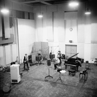 The band in the studio recording A Hard Day's Night